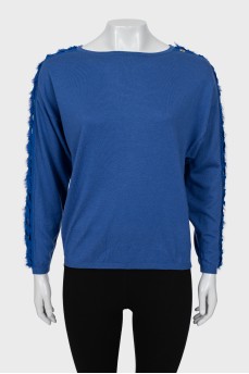 Blue jumper decorated with weaving