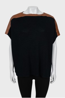 Knitted sweater with leather insert