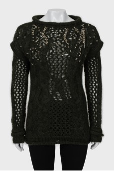Knitted sweater decorated with rhinestones