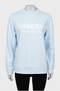 Light blue sweatshirt with text print