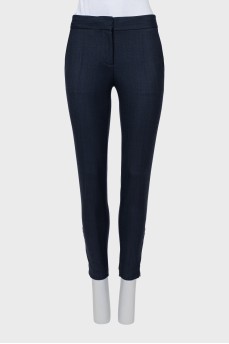 Wool trousers with zippers at the bottom