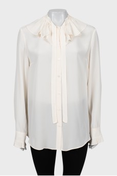 Beige blouse with ruffles