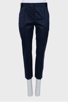 Blue trousers with stitched creases