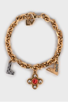 Gold bracelet with charms