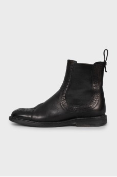 Black leather boots with perforations