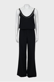 Black jumpsuit decorated with chain