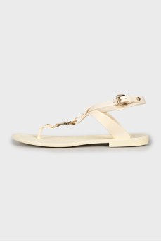 Rubber sandals with gold hardware