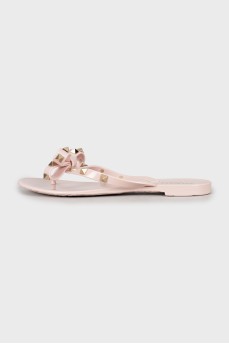 Rubber flip-flops with gold spikes