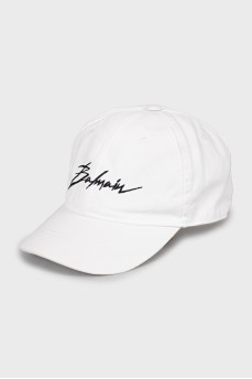 White cap with embroidered print