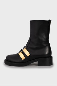 Leather boots with gold hardware