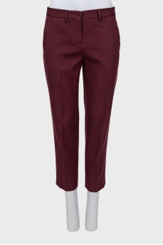 Cropped burgundy trousers with arrows