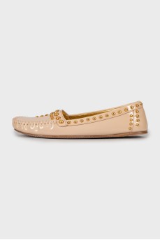 Leather moccasins with golden decoration