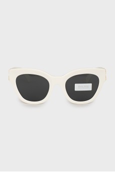 Sunglasses with gold logo and tag