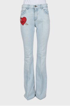 Blue flared jeans with patch