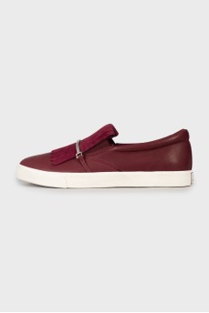 Leather slip-ons with tag