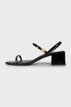 Black sandals with gold hardware