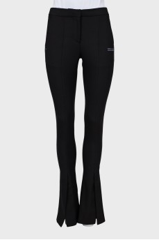 Black flared trousers with slits at the bottom
