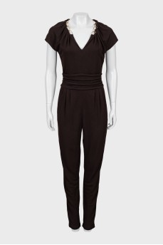 Fitted jumpsuit decorated with chain