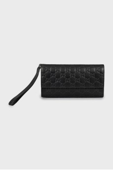 Leather clutch with embossed print