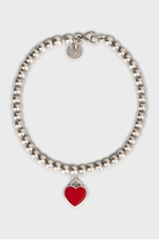 Silver bracelet with heart-shaped pendant