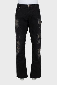 Men's jeans with studs and ripped effect
