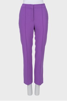 Purple trousers with stitched creases