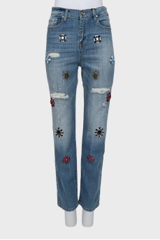 Jeans decorated with rhinestones with tag
