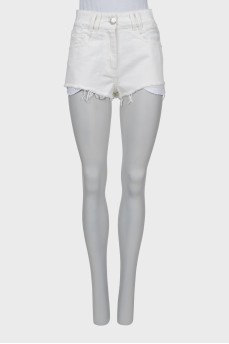 White denim shorts with raw hem