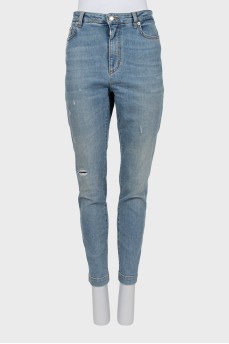 Light blue distressed skinny jeans