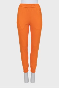 Sports orange joggers with tag