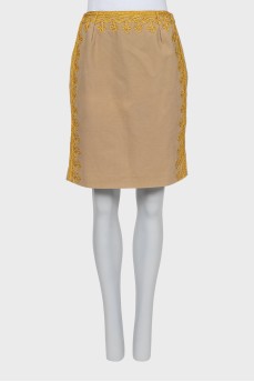 Mini skirt with gold pattern