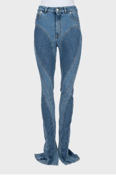 Jeans with raised seams and slits at the bottom