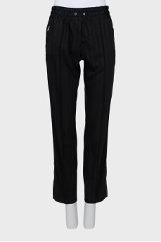 Striped trousers with zipper at the bottom