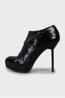 Black leather ankle boots with stiletto heels