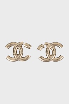 Gold earrings in the shape of the brand logo