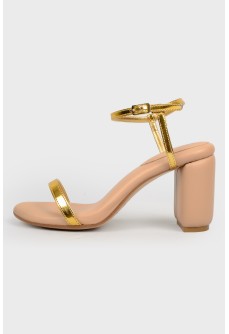 Beige sandals with golden straps