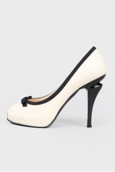 Black heeled white shoes