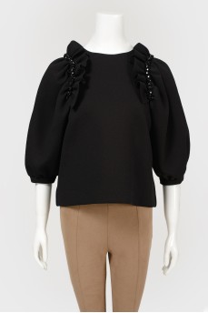 Blouse with voluminous sleeves