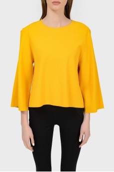 Knitted jumper with cuts on sleeves with a tag