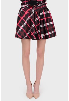 Mini skirt in an abstract cage with a tag