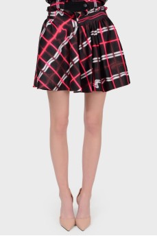 Mini skirt in an abstract cage with a tag