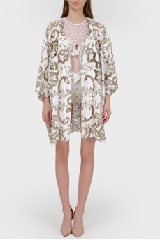 Beach cape in print with tag