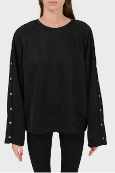 Black sweatshirt with buttons on the sleeves