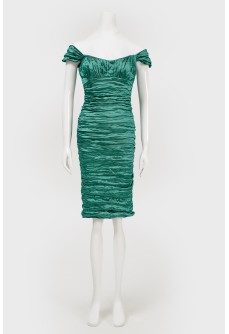 Cocktail green dress in fold