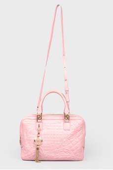 The bag is quilted with golden fittings