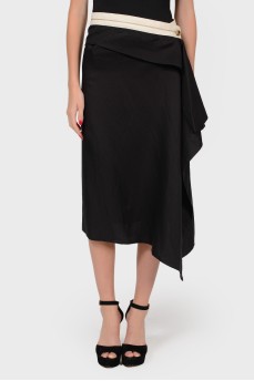 Asymmetric black skirt on buttons