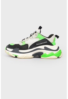 Sneakers with black and light green inserts