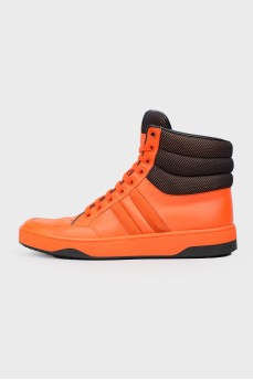Orange leather sneakers are high