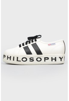Sneakers with an inscription on the sole and black laces