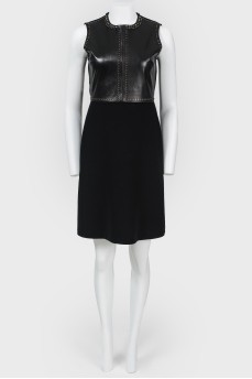 Dress with leather insert and metal appliqué
